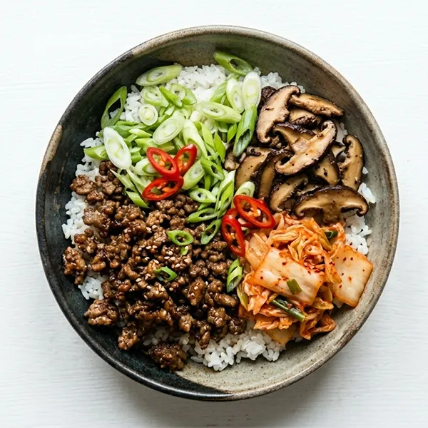 Beef Bibimbap Bowl With Sticky Rice, Mushroom, Kimchi And Pickled Radish